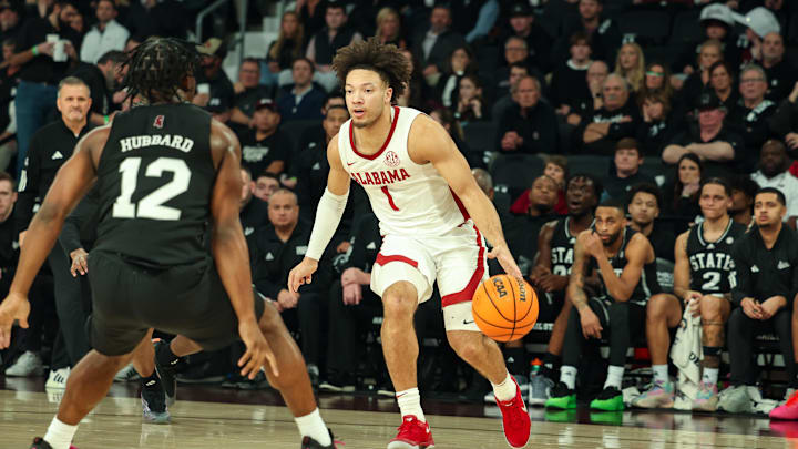 Jan 29, 2025; Starkville, Mississippi, USA; Alabama Crimson Tide guard Mark Sears (1) looks to pass the ball as Mississippi State Bulldogs guard Josh Hubbard (12) defends during the first half at Humphrey Coliseum. Mandatory Credit: Wesley Hale-Imagn Images Jan 29, 2025; Starkville, Mississippi, USA; Alabama Crimson Tide guard Mark Sears (1) looks to pass the ball as Mississippi State Bulldogs guard Josh Hubbard (12) defends during the first half at Humphrey Coliseum. Mandatory Credit: Wesley Hale-Imagn Images