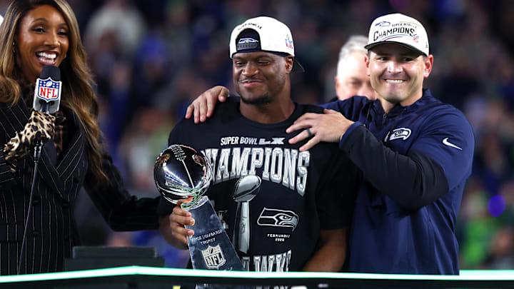 Feb 8, 2026; Santa Clara, CA, USA; Seattle Seahawks head coach Mike MacDonald and running back Kenneth Walker III (9) celebrate with the Vince Lombardi trophy after defeating the New England Patriots in Super Bowl LX at Levi's Stadium. Mandatory Credit: Mark J. Rebilas-Imagn Images
