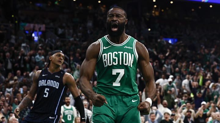 Apr 23, 2025; Boston, Massachusetts, USA; Boston Celtics guard Jaylen Brown (7) shouts out after dunking as Orlando Magic forward Paolo Banchero (5) turns away during the second half of game two of the first round of the 2024 NBA Playoffs at TD Garden. Mandatory Credit: Winslow Townson-Imagn Images