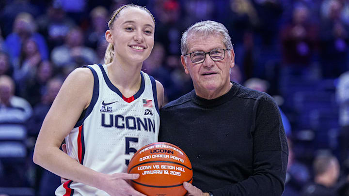 Jan 22, 2025; Storrs, Connecticut, USA; UConn Huskies guard Paige Bueckers (5) is recognized with head coach Geno Auriemma for her 2000 career points before the start of the game against the Villanova Wildcats at Harry A. Gampel Pavilion. Mandatory Credit: David Butler II-Imagn Images