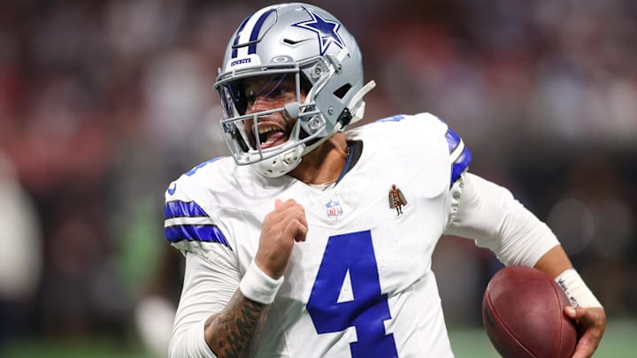 Dallas Cowboys quarterback Dak Prescott (4) runs the ball against the Atlanta Falcons in the second quarter at Mercedes-Benz Stadium.