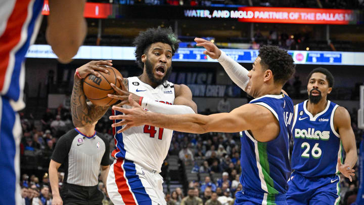 Jan 30, 2023; Dallas, Texas, USA; Dallas Mavericks guard Josh Green (8) looks to knock the ball away from Detroit Pistons forward Saddiq Bey (41) during the second half at the American Airlines Center. Mandatory Credit: Jerome Miron-USA TODAY Sports