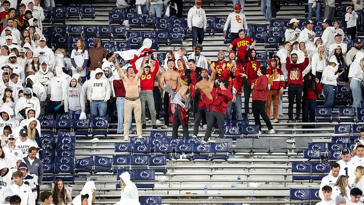 USC Trojans fans celebrate as Penn State Nittany Lion fans leave following the White Out game at Beaver Stadium. USC Trojans fans celebrate as Penn State Nittany Lion fans leave following the White Out game at Beaver Stadium.