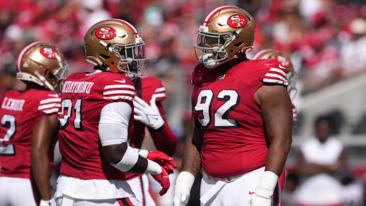 Oct 6, 2024; Santa Clara, California, USA; San Francisco 49ers defensive tackles Sam Okuayinonu (left) and Jordan Elliott (92) talk during the first quarter against the Arizona Cardinals at Levi's Stadium. Mandatory Credit: Darren Yamashita-Imagn Images