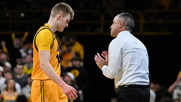 Feb 25, 2026; Iowa City, Iowa, USA; Iowa Hawkeyes head coach Ben McCollum talks with guard Bennett Stirtz (14) during the first half against the Ohio State Buckeyes at Carver-Hawkeye Arena. Mandatory Credit: Jeffrey Becker-Imagn Images