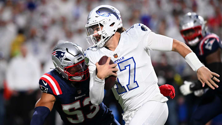 Oct 5, 2025; Orchard Park, New York, USA; Buffalo Bills quarterback Josh Allen (17) rushes the ball past New England Patriots linebacker Christian Elliss (53) during the first half at Highmark Stadium.