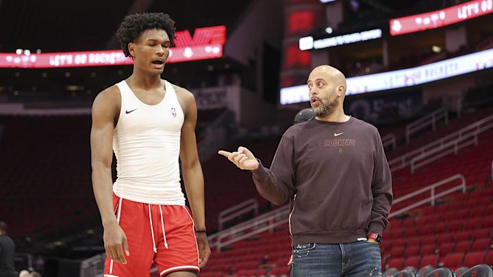 Jan 6, 2024; Houston, Texas, USA; Houston Rockets general manager Rafael Stone (right) talks with Rockets forward Amen Thompson (1) before the game against the Milwaukee Bucks at Toyota Center. Mandatory Credit: Troy Taormina-Imagn Images