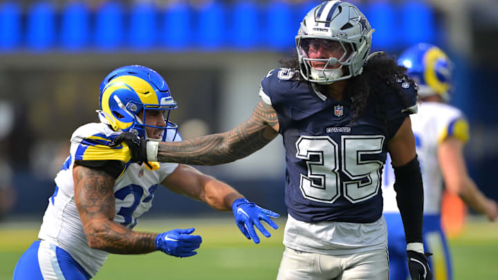 Dallas Cowboys linebacker Marist Liufau grabs a hold of Los Angeles Rams running back Cody Schrader. Dallas Cowboys linebacker Marist Liufau grabs a hold of Los Angeles Rams running back Cody Schrader.
