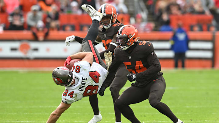 Nov 27, 2022; Cleveland, Ohio, USA; Tampa Bay Buccaneers tight end Cameron Brate (84) is tackled by
