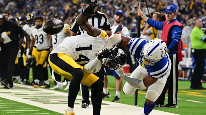 Sep 29, 2024; Indianapolis, Indiana, USA; Indianapolis Colts safety Nick Cross (20) knocks the ball out of hands of Pittsburgh Steelers wide receiver George Pickens (14) for a fumble during the second quarter at Lucas Oil Stadium. Mandatory Credit: Marc Lebryk-Imagn Images Sep 29, 2024; Indianapolis, Indiana, USA; Indianapolis Colts safety Nick Cross (20) knocks the ball out of hands of Pittsburgh Steelers wide receiver George Pickens (14) for a fumble during the second quarter at Lucas Oil Stadium. Mandatory Credit: Marc Lebryk-Imagn Images