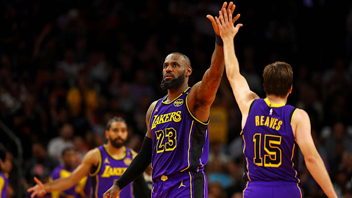 Oct 28, 2024; Phoenix, Arizona, USA; Los Angeles Lakers forward LeBron James (23) celebrates with guard Austin Reaves (15) after a play during the second half against the Phoenix Suns at Footprint Center. Mandatory Credit: Mark J. Rebilas-Imagn Images