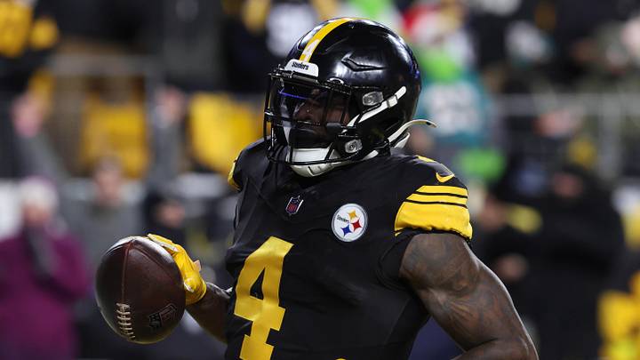 Dec 15, 2025; Pittsburgh, Pennsylvania, USA; Pittsburgh Steelers wide receiver DK Metcalf (4) scores a touchdown in the third quarter against the Miami Dolphins at Acrisure Stadium.