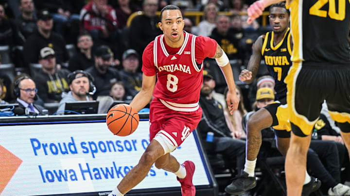 Jan 11, 2025; Iowa City, Iowa, USA; Indiana Hoosiers forward Bryson Tucker (8) brings the ball up court against the Iowa Hawkeyes during the first half at Carver-Hawkeye Arena. Mandatory Credit: Jeffrey Becker-Imagn Images