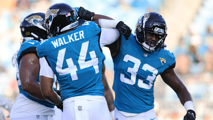Jacksonville Jaguars linebacker Travon Walker (44) greets linebacker Devin Lloyd (33) before the game of a preseason matchup Saturday, Aug. 26, 2023 at EverBank Stadium in Jacksonville, Fla. [Corey Perrine/Florida Times-Union]