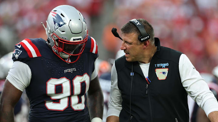 Nov 9, 2025; Tampa, Florida, USA; New England Patriots defensive tackle Christian Barmore (90) talks with head coach Mike Vrabel during the third quarter against the Tampa Bay Buccaneers at Raymond James Stadium. Mandatory Credit: Nathan Ray Seebeck-Imagn Images Nov 9, 2025; Tampa, Florida, USA; New England Patriots defensive tackle Christian Barmore (90) talks with head coach Mike Vrabel during the third quarter against the Tampa Bay Buccaneers at Raymond James Stadium. Mandatory Credit: Nathan Ray Seebeck-Imagn Images