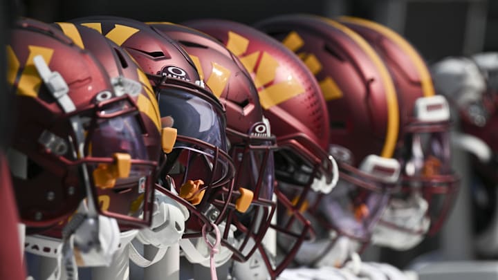 Oct 13, 2024; Baltimore, Maryland, USA;  Washington Commanders helmets like the bench during the firxt half against the Baltimore Ravens at M&T Bank Stadium. Mandatory Credit: Tommy Gilligan-Imagn Images