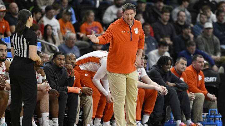 Mar 20, 2025; Providence, RI, USA; Clemson Tigers head coach Brad Brownell talks with an official during the first half against the McNeese State Cowboys at Amica Mutual Pavilion. Mandatory Credit: Eric Canha-Imagn Images