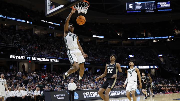 Mar 21, 2025; Cleveland, OH, USA; Michigan State Spartans guard Jeremy Fears Jr. (1) dunks the ball in the second half against the Bryant University Bulldogs during the NCAA Tournament First Round at Rocket Mortgage Fieldhouse. Mandatory Credit: Rick Osentoski-Imagn Images Mar 21, 2025; Cleveland, OH, USA; Michigan State Spartans guard Jeremy Fears Jr. (1) dunks the ball in the second half against the Bryant University Bulldogs during the NCAA Tournament First Round at Rocket Mortgage Fieldhouse. Mandatory Credit: Rick Osentoski-Imagn Images