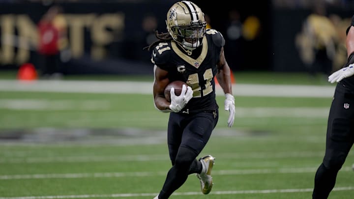 Dec 1, 2024; New Orleans, Louisiana, USA; New Orleans Saints running back Alvin Kamara (41) runs against the Los Angeles Rams during the first half at Caesars Superdome. Mandatory Credit: Matthew Hinton-Imagn Images
