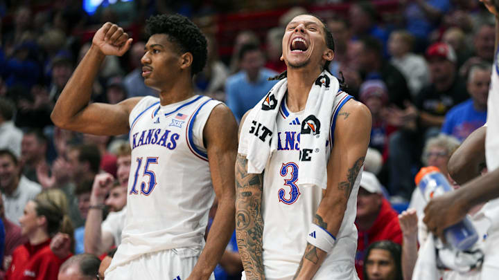 Dec 16, 2025; Lawrence, Kansas, USA; Kansas Jayhawks forward Bryson Tiller (15) and guard Tre White (3) celebrate during the second half against the Towson Tigers at Allen Fieldhouse. Mandatory Credit: Jay Biggerstaff-Imagn Images