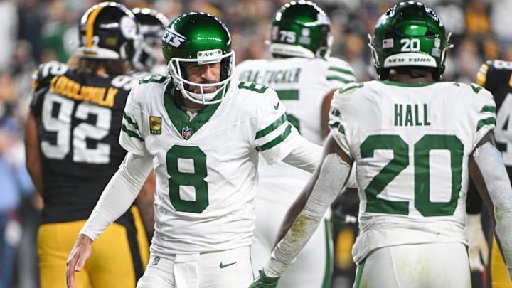 Oct 20, 2024; Pittsburgh, Pennsylvania, USA; New York Jets running back Breece Hall (20) and quarterback Aaron Rodgers (8) celebrate a touchdown agianst the Pittsburgh Steelers during the first quarter at Acrisure Stadium. 