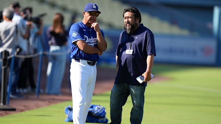 Aug 29, 2025; Los Angeles, California, USA; Los Angeles Dodgers manager Dave Roberts (30) talks with Los Angeles Times columnist Dylan Hernandez before the game Arizona Diamondbacks at Dodger Stadium. Mandatory Credit: Kirby Lee-Imagn Images
