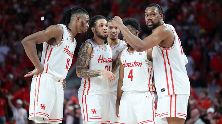 Houston basketball players huddle up during a recent game. Houston basketball players huddle up during a recent game.