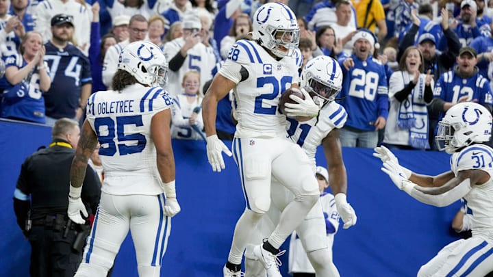 Dec 22, 2024; Indianapolis, Indiana, USA; Indianapolis Colts running back Jonathan Taylor (28) celebrates with his teammates after rushing for a touchdown during a game against the Tennessee Titans at Lucas Oil Stadium. Mandatory Credit: Grace Hollars/USA Today Network via Imagn Images 