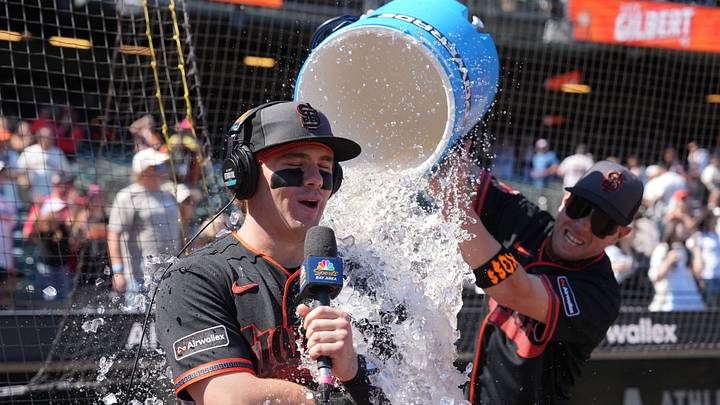 San Francisco, California, USA; San Francisco Giants center fielder Drew Gilbert (left) is doused by third baseman Christian Koss (right) after defeating the Colorado Rockies at Oracle Park. Mandatory Credit: Darren Yamashita-Imagn Images San Francisco, California, USA; San Francisco Giants center fielder Drew Gilbert (left) is doused by third baseman Christian Koss (right) after defeating the Colorado Rockies at Oracle Park. Mandatory Credit: Darren Yamashita-Imagn Images