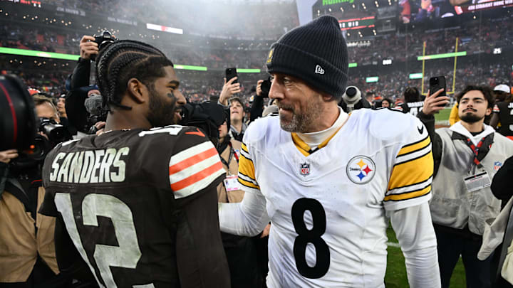 Dec 28, 2025; Cleveland, Ohio, USA; Pittsburgh Steelers quarterback Aaron Rodgers (8) and Cleveland Browns quarterback Shedeur Sanders (12) hug after the game at Huntington Bank Field. Mandatory Credit: Ken Blaze-Imagn Images
