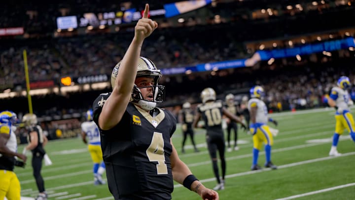 Dec 1, 2024; New Orleans, Louisiana, USA; New Orleans Saints quarterback Derek Carr (4) reacts after rushing for a first down against the Los Angeles Rams during the fourth quarter at Caesars Superdome. Mandatory Credit: Matthew Hinton-Imagn Images