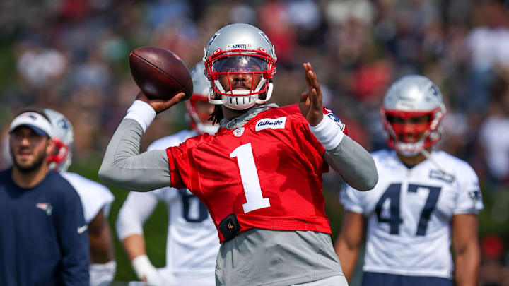 Jul 28, 2021; Foxborough, MA, United States; New England Patriots quarterback Cam Newton (1) throws a pass during training ca Jul 28, 2021; Foxborough, MA, United States; New England Patriots quarterback Cam Newton (1) throws a pass during training ca