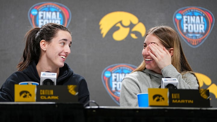 Iowa Hawkeyes guard Caitlin Clark (22) and Iowa Hawkeyes guard Kate Martin (20) take questions at Rocket Mortgage Arena, Thursday, April 4, 2024 in Cleveland.