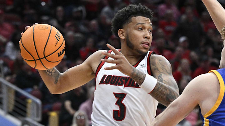 Nov 4, 2024; Louisville, Kentucky, USA; Louisville Cardinals guard Koren Johnson (3) looks to pass again Morehead State Eagles guard Kade Ruegsegger (3) during the second half at KFC Yum! Center. Louisville defeated Morehead State 93-45. Mandatory Credit: Jamie Rhodes-Imagn Images Nov 4, 2024; Louisville, Kentucky, USA; Louisville Cardinals guard Koren Johnson (3) looks to pass again Morehead State Eagles guard Kade Ruegsegger (3) during the second half at KFC Yum! Center. Louisville defeated Morehead State 93-45. Mandatory Credit: Jamie Rhodes-Imagn Images