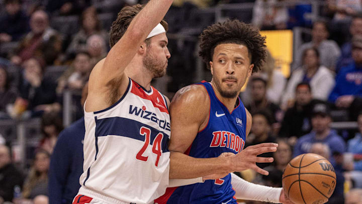 Nov 27, 2023; Detroit, Michigan, USA; Washington Wizards forward Corey Kispert (24) defends against Cade Cunningham of the Detroit Pistons 