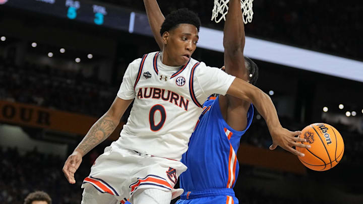 Apr 5, 2025; San Antonio, TX, USA;  Auburn Tigers guard Tahaad Pettiford (0) passes the ball against the Florida Gators in the semifinals of the men's Final Four of the 2025 NCAA Tournament at the Alamodome.