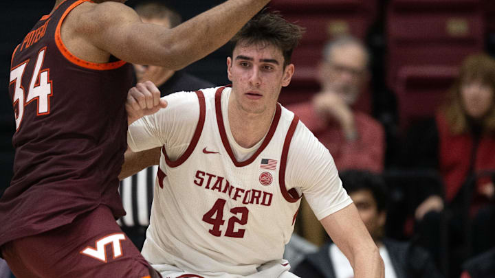 Jan 8, 2025; Stanford, California, USA; Stanford Cardinal forward Maxime Raynaud (42) tries to back down Virginia Tech Hokies forward Mylyjael Poteat (34) during the second half at Maples Pavilion. Mandatory Credit: D. Ross Cameron-Imagn Images Jan 8, 2025; Stanford, California, USA; Stanford Cardinal forward Maxime Raynaud (42) tries to back down Virginia Tech Hokies forward Mylyjael Poteat (34) during the second half at Maples Pavilion. Mandatory Credit: D. Ross Cameron-Imagn Images