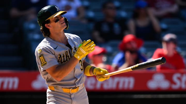 Sep 7, 2025; Anaheim, California, USA; Athletics right fielder Colby Thomas (32) hits a sacrifice fly to tie the game against the Los Angeles Angels during the eighth inning at Angel Stadium. Mandatory Credit: William Liang-Imagn Images