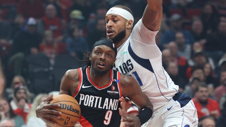 Dec 1, 2024; Portland, Oregon, USA; Portland Trail Blazers forward Jerami Grant (9) drives on Dallas Mavericks center Daniel Gafford (21) in the first half at Moda Center. Mandatory Credit: Jaime Valdez-Imagn Images