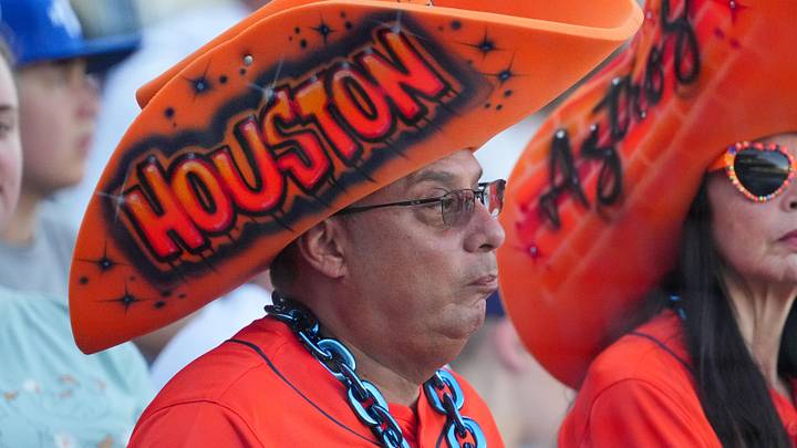 Jun 13, 2026; Kansas City, Missouri, USA; Two Houston Astros fans watch warm ups prior to a game between the Houston Astros and Kansas City Royals at Kauffman Stadium. Mandatory Credit: Denny Medley-Imagn Images Jun 13, 2026; Kansas City, Missouri, USA; Two Houston Astros fans watch warm ups prior to a game between the Houston Astros and Kansas City Royals at Kauffman Stadium. Mandatory Credit: Denny Medley-Imagn Images