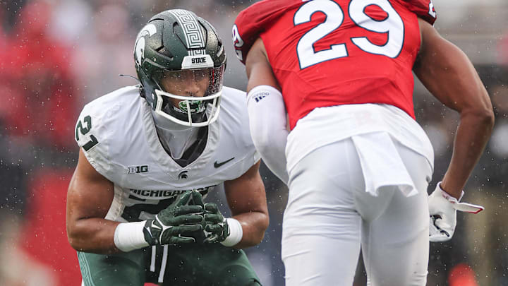 Oct 14, 2023; Piscataway, New Jersey, USA; Michigan State Spartans defensive back Dillon Tatum (21) defends Rutgers Scarlet Knights wide receiver Ian Strong (29) during the first half at SHI Stadium. Mandatory Credit: Vincent Carchietta-Imagn Images