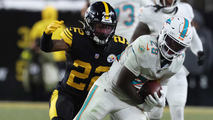 Miami Dolphins running back De'Von Achane (28) is tackled by Pittsburgh Steelers cornerback Asante Samuel Jr. (22) in the second quarter at Acrisure Stadium.