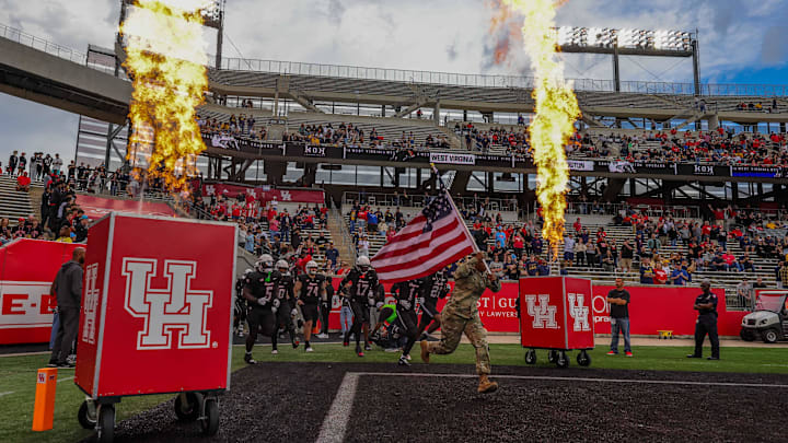Nov 1, 2025; Houston, Texas, USA; A soldier leads the Houston Cougars out onto the field before playing against the West Virginia Mountaineers at TDECU Stadium. Mandatory Credit: Thomas Shea-Imagn Images