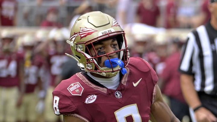 Sep 14, 2024; Tallahassee, Florida, USA; Memphis Tigers wide receiver Koby Drake (10) runs the ball against Florida State Seminoles defensive back Azareye'h Thomas (8) during the first half at Doak S. Campbell Stadium. Mandatory Credit: Melina Myers-Imagn Images Sep 14, 2024; Tallahassee, Florida, USA; Memphis Tigers wide receiver Koby Drake (10) runs the ball against Florida State Seminoles defensive back Azareye'h Thomas (8) during the first half at Doak S. Campbell Stadium. Mandatory Credit: Melina Myers-Imagn Images
