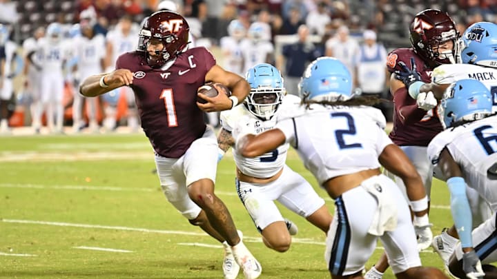 Sep 13, 2025; Blacksburg, Virginia, USA;  Virginia Tech Hokies quarterback Kyron Drones (1) runs the ball during the fourth quarter at Lane Stadium. Mandatory Credit: Brian Bishop-Imagn Images