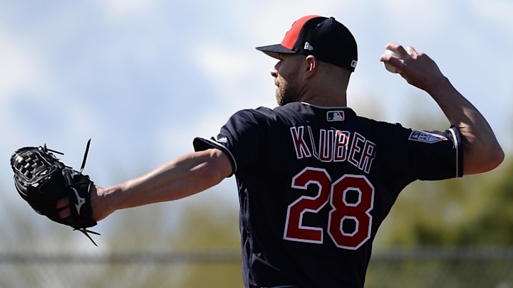 Goodyear, AZ, USA; Cleveland Indians starting pitcher Corey Kluber (28) throws during a spring training workout at the Goodyear Ballpark practice fields.