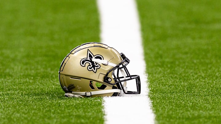 Aug 25, 2024; New Orleans, Louisiana, USA; New Orleans Saints helmet on the turf during warmups before the game against the Tennessee Titans at Caesars Superdome. Mandatory Credit: Stephen Lew-Imagn Images Aug 25, 2024; New Orleans, Louisiana, USA; New Orleans Saints helmet on the turf during warmups before the game against the Tennessee Titans at Caesars Superdome. Mandatory Credit: Stephen Lew-Imagn Images