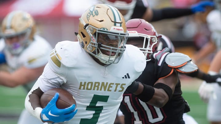 Poplarville's Tylan Keys (5) carries for yardage against Louisville during the MHSAA 4A championship game in Hattiesburg, Miss., Saturday, Dec. 7, 2024. Poplarville's Tylan Keys (5) carries for yardage against Louisville during the MHSAA 4A championship game in Hattiesburg, Miss., Saturday, Dec. 7, 2024.