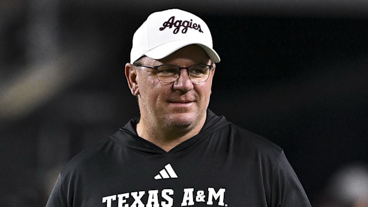 Nov 16, 2024; College Station, Texas, USA; Texas A&M Aggies head coach Mike Elko walks on the field prior to the game against the New Mexico State Aggies at Kyle Field. Mandatory Credit: Maria Lysaker-Imagn Images 