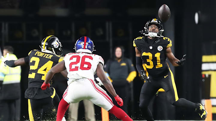 Oct 28, 2024; Pittsburgh, Pennsylvania, USA;  Pittsburgh Steelers cornerback Beanie Bishop Jr. (31) intercepts a pass intended for New York Giants running back Devin Singletary (26) during the fourth quarter at Acrisure Stadium.  
